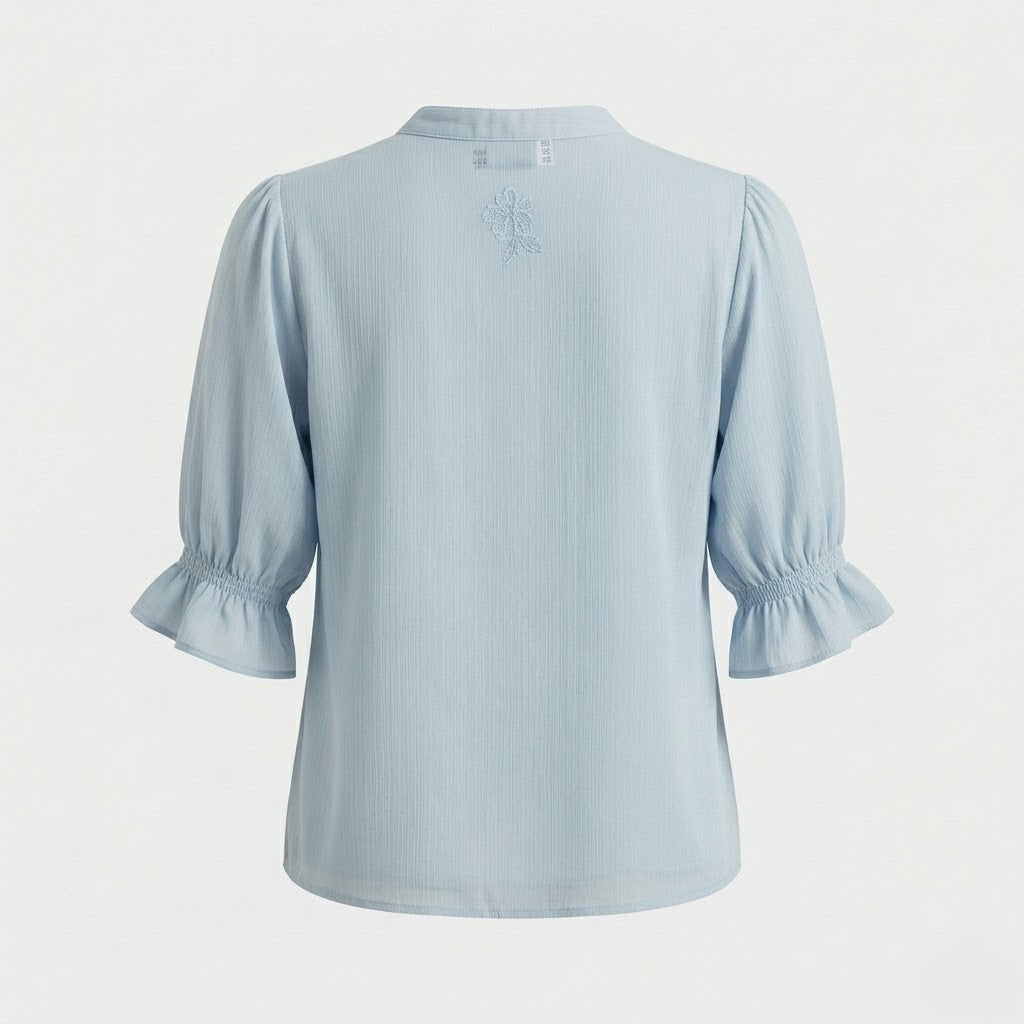 Blouse bleue à broderie