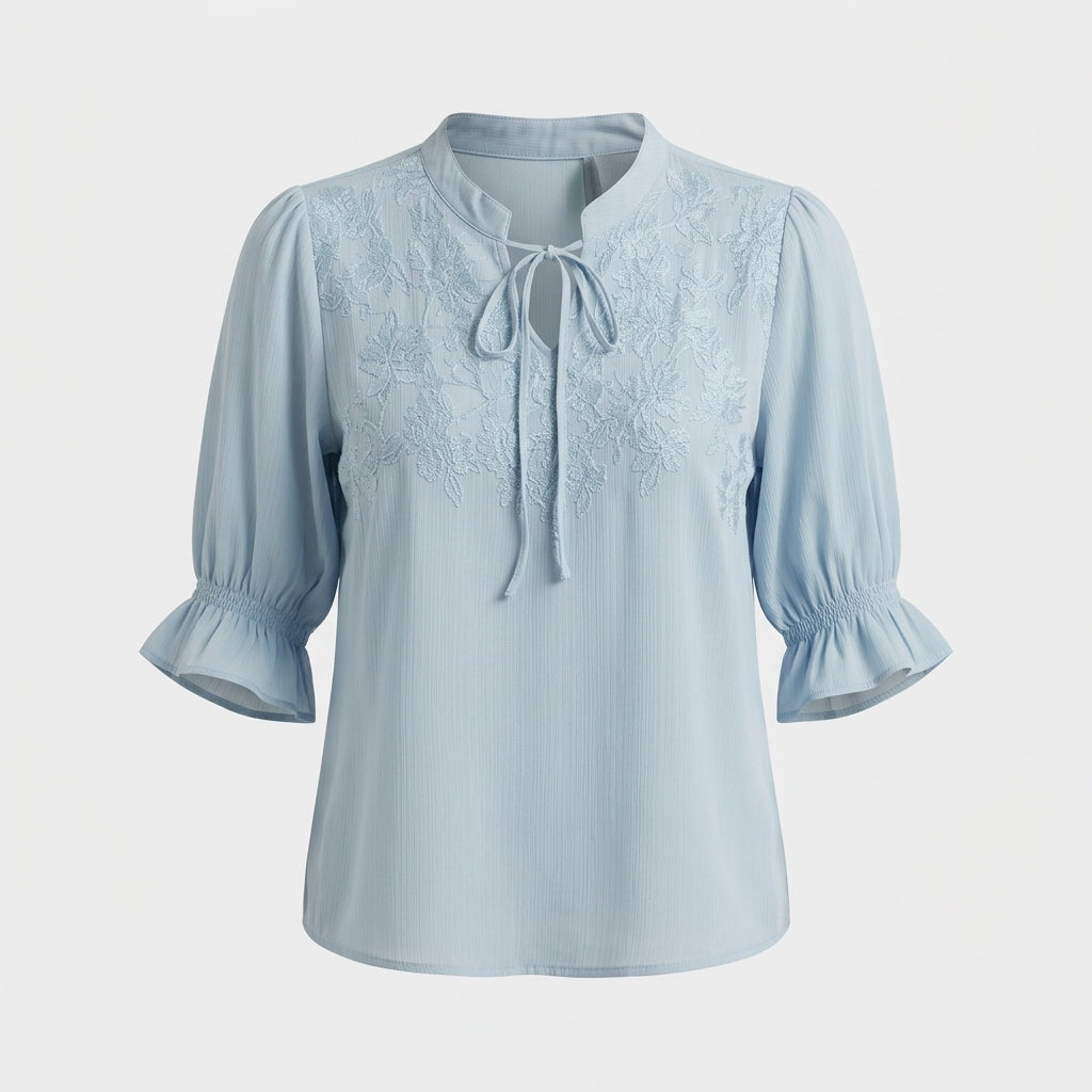 Blouse bleue à broderie