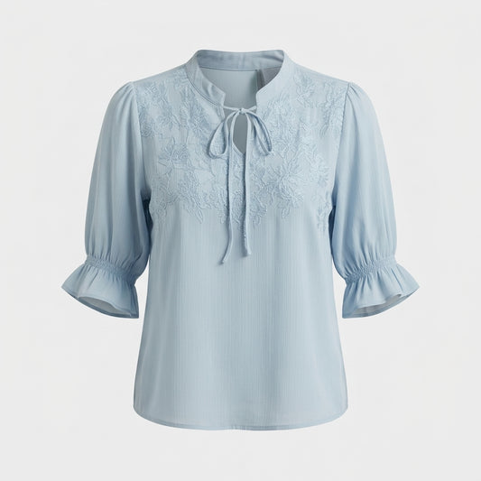 Blouse bleue à broderie